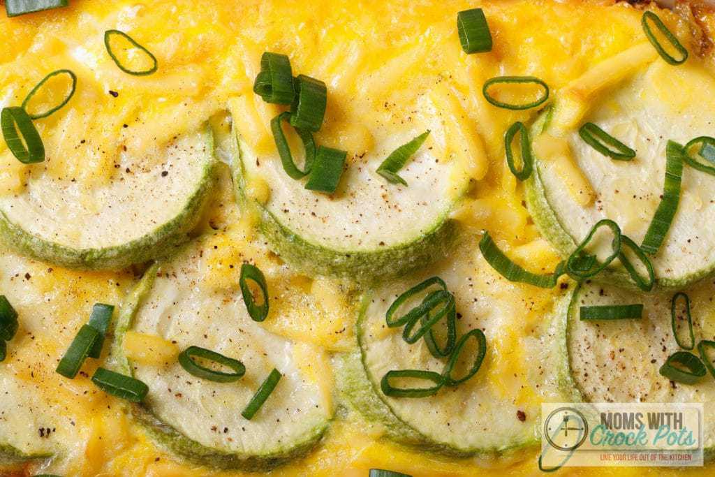Baked zucchini, eggs and cheese top view Moms with Crockpots