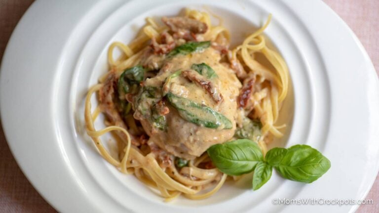 Plate of chicken and pasta with basil